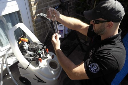 Richard Pettifer setting up a central heating powerflush machine